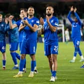 Kemar Roofe leads the Rangers squad in applauding the travelling fans at full time in Seville. 