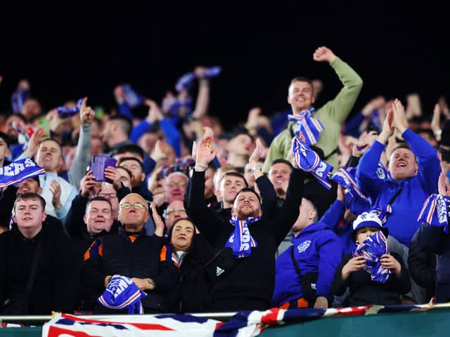 Rangers fans celebrate after their team's 3-2 victory over Real Betis and qualification to the round of 16 in the UEFA Europa League.