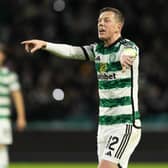 Celtic captain Callum McGregor passes on instructions to his team mates during a UEFA Champions League match against Feyenoord.