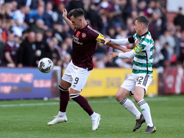 Lawrence Shankland of Hearts holds off Calum McGregor of Celtic at Tynecastle.