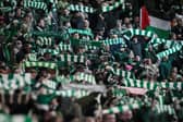 Celtic's supporters cheer during the UEFA Champions League group E football match between Celtic and Fyenoord at Celtic Park (Pic: Getty)