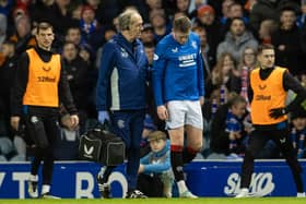 Rangers' John Lundstram gets treatment for an injury after a foul by St Johnstone's Diallang Jaiyesim