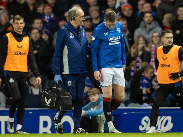 Rangers' John Lundstram gets treatment for an injury after a foul by St Johnstone's Diallang Jaiyesim