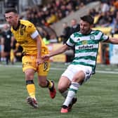 Celtic's Greg Taylor and Jason Holt of Livingston in action during the previous meeting between the sides