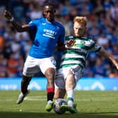 Celtic's Liam Scales and Rangers' Abdallah Sima in action at Ibrox