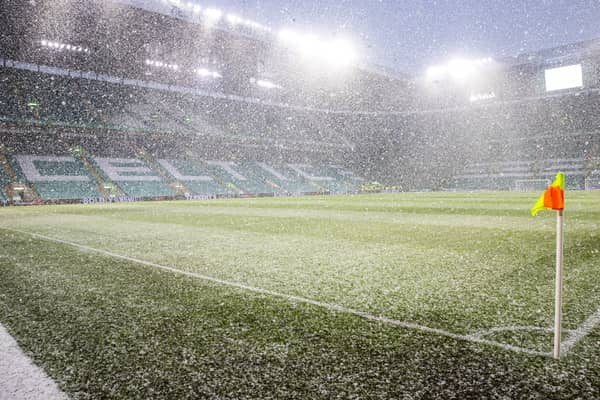 Snow falls at Celtic Park before kick-off