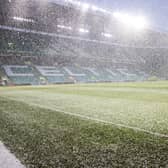 Snow falls at Celtic Park before kick-off