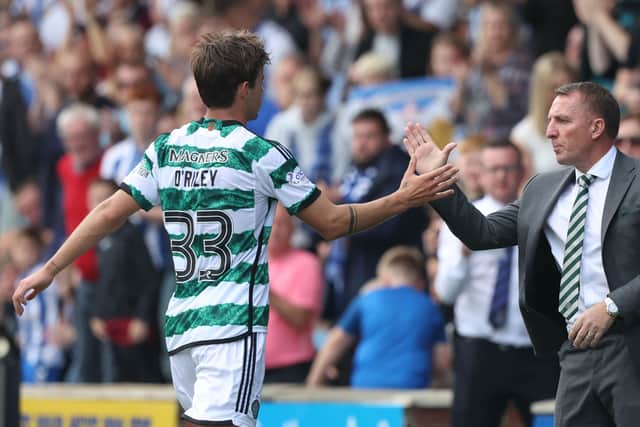 Celtic manager Brendan Rodgers embraces Matt O'Riley 