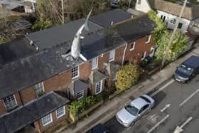 The owner of a world-famous house with a 25ft shark sticking out of the roof has been banned from renting it out on Airbnb Picture: Tom Wren / SWNS