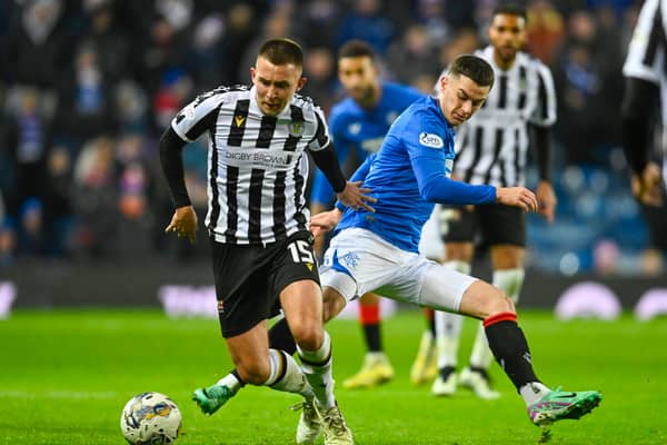 St Mirren's Caolan Boyd-Munce tries to get away from Rangers' Tom Lawrence 