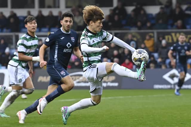 Celtic's Kyogo Furuhashi brings the ball down under pressure against Ross County