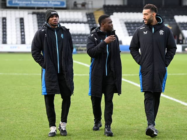 Rangers' Dujon Sterling, Rabbi Matondo and Connor Goldson out inspection the pitch at the SMiSA Stadium