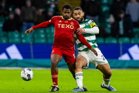 Celtic's Cameron Carter-Vickers and Aberdeen's Luis Lopes wrestle for possession