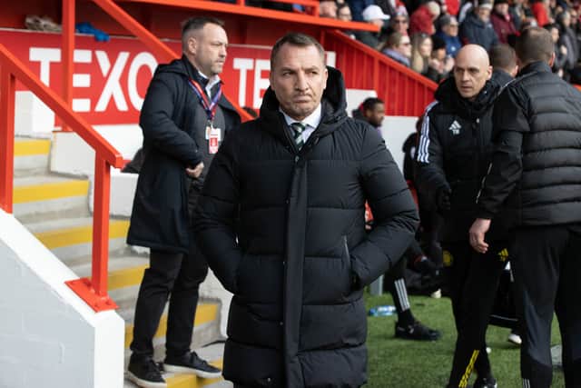 Celtic manager Brendan Rodgers takes his position in the dugout ahead of kick-off