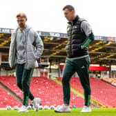 Celtic's Callum McGregor and Liam Scales check out the pitch