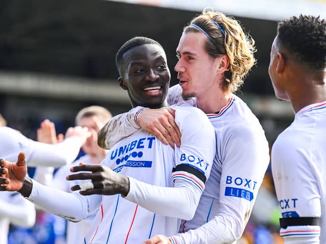 Mohamed Diomande celebrates his opening goal with Todd Cantwell. SNS.