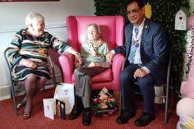 Betty being congratulated on her 100th birthday by Provost Margaret Cooper (on behalf of South Lanarkshire) and Deputy Lord Lieutenant for Lanarkshire Liaquat Ali (on behalf of the King). 