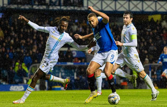 Rangers' Cyriel Dessers (R) and Dundee's Malachi Boateng in action