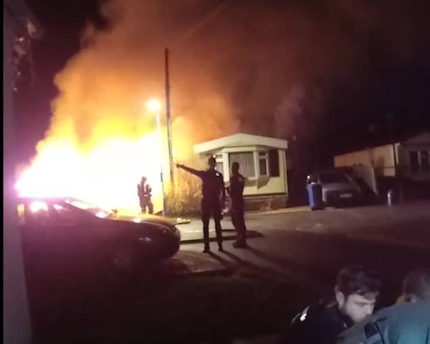 Bodycam footage shows heroic police response to a large caravan fire in Cranbourne.