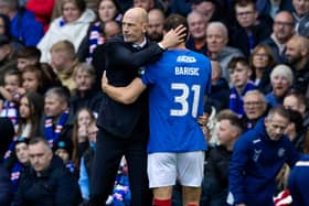 Rangers' Borna Barisic (R) with manager Phillipe Clement after being forced off with an injury against Hibs in October 2023