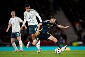 Ryan Christie battles with Shea Charles. Cr. Getty Images.