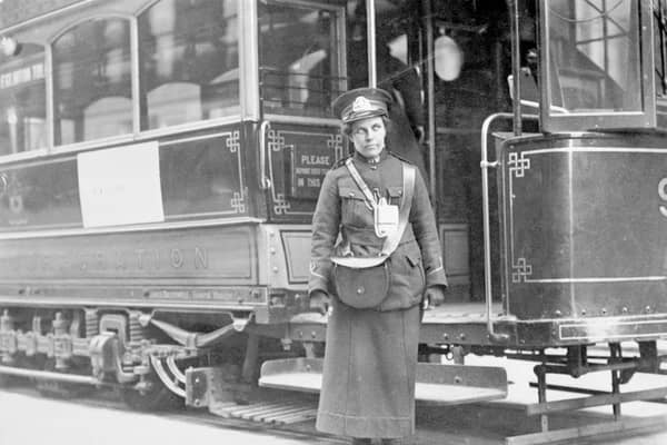 A tram conductor in her winter uniform, possibly in Glasgow, 1915. Glasgow pioneered the use of female operatives on its public transport system during the war. Male colleagues opposed their presence, declaring such work to be 'unwomanly', physically demanding and morally dangerous. 