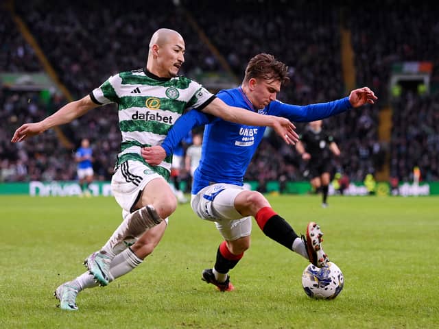 Ridvan Yilmaz of Rangers on the ball whilst under pressure from Daizen Maeda of Celtic
