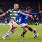 Ridvan Yilmaz of Rangers on the ball whilst under pressure from Daizen Maeda of Celtic