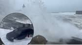 Waves soak car as Storm Kathleen batters British coast.