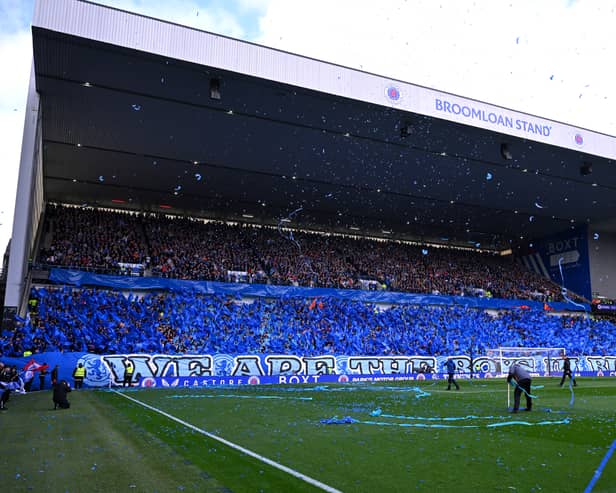 Rangers fans in the Broomloan stand throw ticker tape and wave flags before kick-off against Celtic