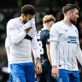 Rangers' Connor Goldson (L) and John Souttar look dejected at full-time.