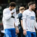 Rangers' Connor Goldson (L) and John Souttar look dejected at full-time.