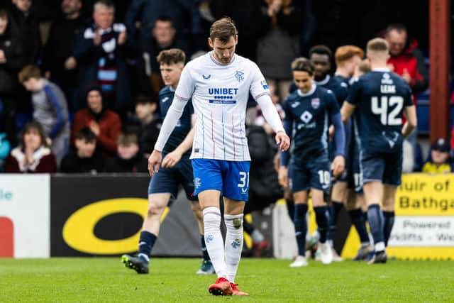 Rangers' Borna Barisic looks dejected as Ross County's Simon Murray celebrates as he scores to make it 1-1 