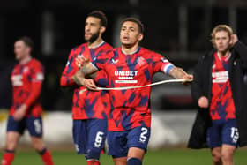 Rangers captain James Tavernier cuts a dejected figure as he trudges off the pitch at full time