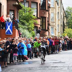 Sebastian Kigongo Semakula of Uganda is cheered on by spectators in the Men's Road Race during day eleven of the Glasgow 2014 Commonwealth Games on August 3, 2014.