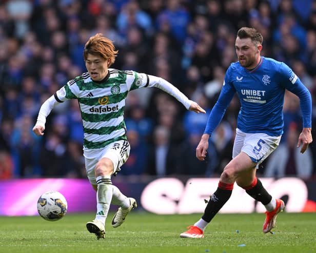  Celtic player Kyogo Furuhashi (l) is challenged by John Souttar of Rangers