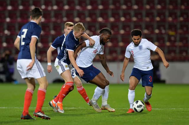 Joshua Onomah of England U21 is challenged by Ross McCrorie of Scotland U21 during the 2019 UEFA European Under-21 Championship Qualifier match