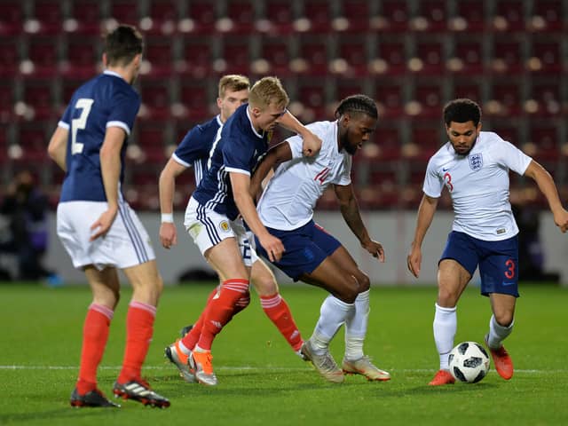 Joshua Onomah of England U21 is challenged by Ross McCrorie of Scotland U21 during the 2019 UEFA European Under-21 Championship Qualifier match