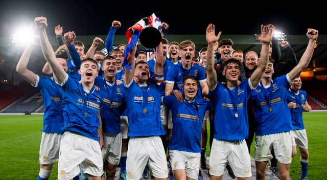 Rangers players lift the Youth Cup Trophy after a Youth Cup Final in 2022