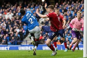 Kilmarnock's Joe Wright blocks an effort by Rangers' Dujon Sterling with his hand which leads to a penalty and a red card following a VAR check 