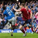Kilmarnock's Joe Wright blocks an effort by Rangers' Dujon Sterling with his hand which leads to a penalty and a red card following a VAR check 