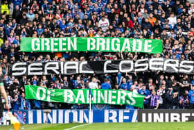 Rangers fans display a banner which reads 'Green Brigade Serial Losers Of Banners' 