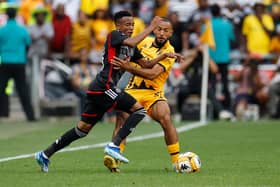 Orlando Pirates' Relebohile Mofokeng fights for the ball with Kaizer Chiefs' Reeve Frosler during a Premier Soccer League (PSL) South African Premier Division match