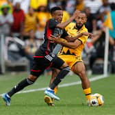 Orlando Pirates' Relebohile Mofokeng fights for the ball with Kaizer Chiefs' Reeve Frosler during a Premier Soccer League (PSL) South African Premier Division match