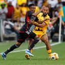 Orlando Pirates' Relebohile Mofokeng fights for the ball with Kaizer Chiefs' Reeve Frosler during a Premier Soccer League (PSL) South African Premier Division match
