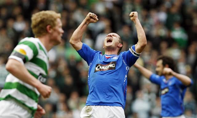 Rangers Captain Barry Ferguson (C) celebrates at the final whistle against Celtic in March 2008