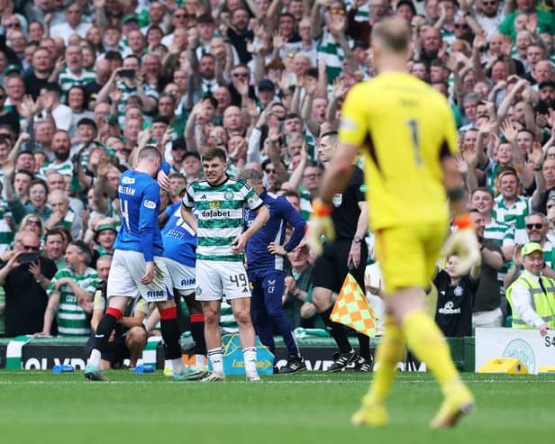 James Forrest of Celtic reacts after John Lundstram is sent off.