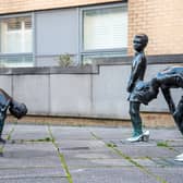 The Gorbals Boys statues can be found in the Gorbals on the corner of Cumberland Street and Queen Elizabeth Gardens. The sculptures are based on a well-known photograph by photographer Oscar Marzaroli and depicts three little boys playing with their mothers’ high heels in the 1960s.