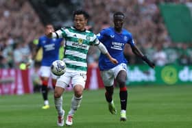 Reo Hatate of Celtic controls the ball whilst under pressure from Mohamed Diomande of Rangers during last weekend's Old Firm clash