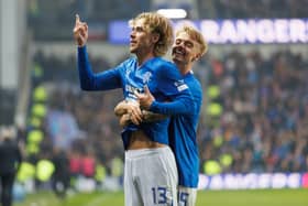 Todd Cantwell of Rangers celebrates his team's third goal  against Dundee at Ibrox with Ross McCausland
